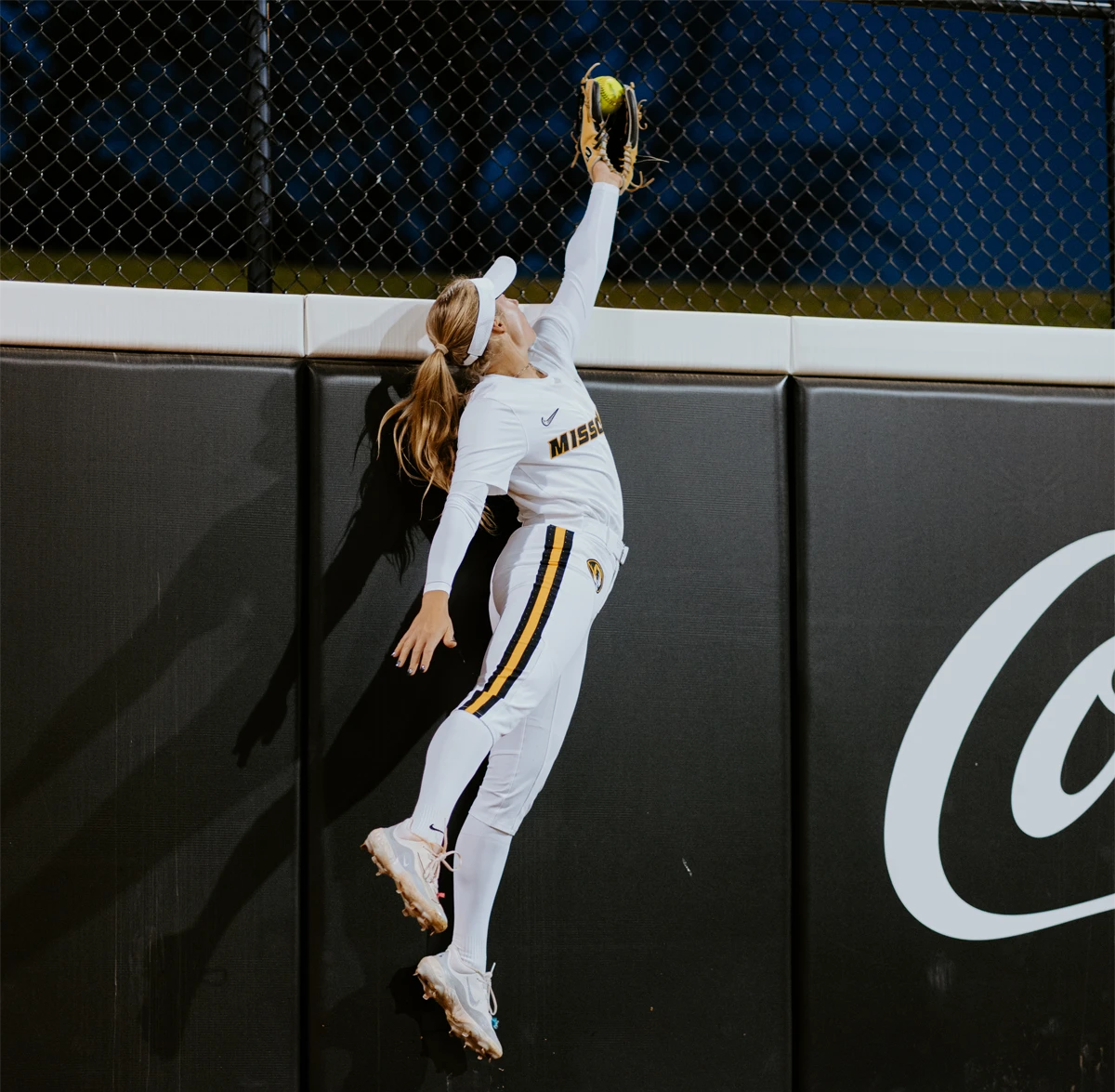 Missouri softball player catching ball